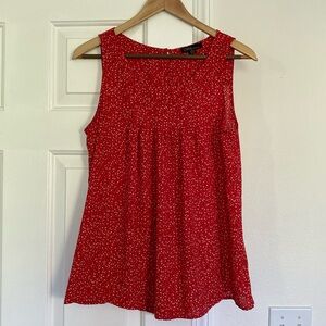 Dahlia polka dot sleeveless blouse.